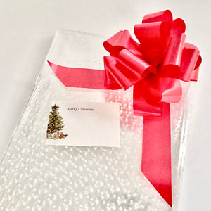 White dot Cellophane hamper wrap / red pull bow and Christmas tree card