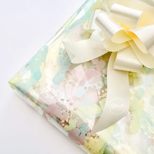 ShredAstic®️ Baby Print Footprints- Florist Cellophane & cream Pull Bow