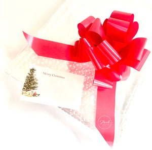 White dot Cellophane hamper wrap / red pull bow and Christmas tree card