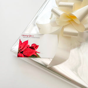 clear Cellophane hamper wrap / cream pull bow and Christmas message card